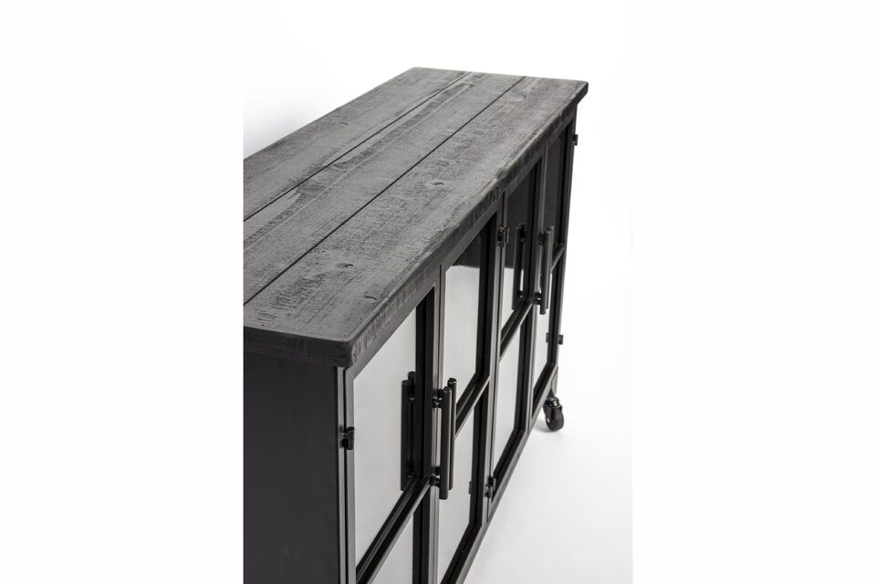 Dit dressoir is gemaakt van stevig zwart hout en combineert een moderne esthetiek met praktische